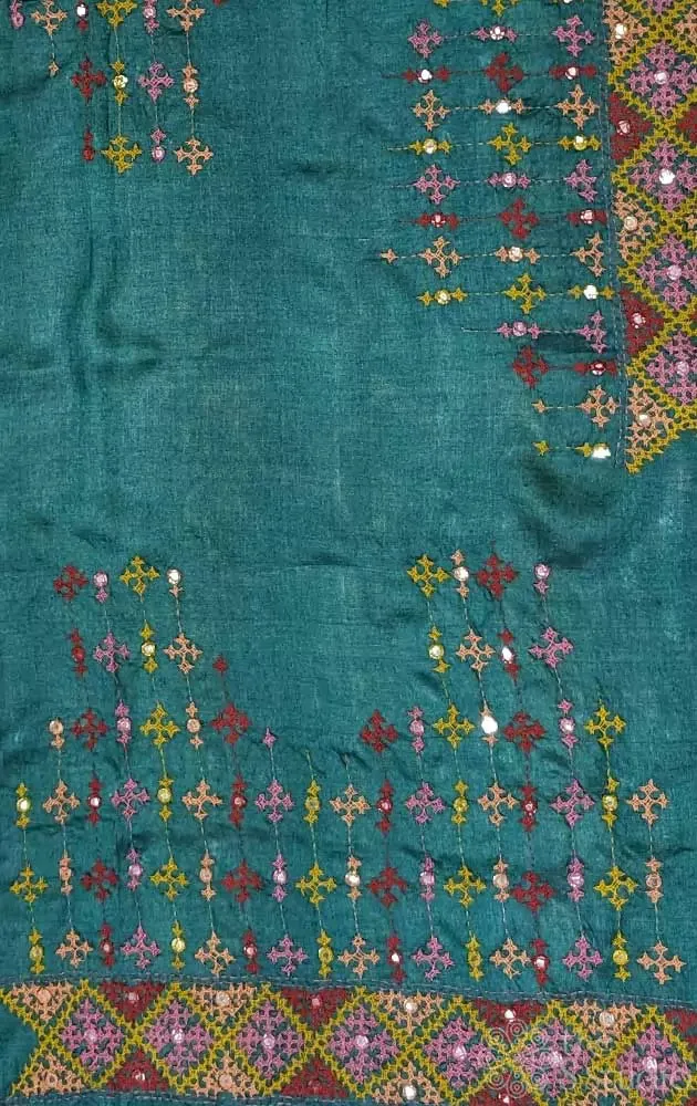 Dark green tussar silk material featuring mirror work kutch hand embroidery